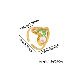 Detailed size measurement of a heart-shaped steel ring with dried flowers