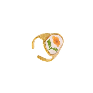 Minimalist gold adjustable hammered ring featuring a resin-encased orange preserved flower