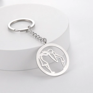 Detailed view of silver stainless steel keychain featuring a mother and child silhouette