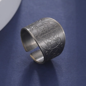 Detail of vintage copper hexagonal ring featuring sacred geometry Metatron Cube engraving