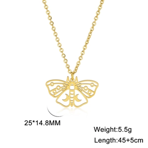 Detailed view of hollow moth pendant with crescent moon patterns in gold finish