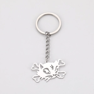 Detailed view of cutout stainless steel cat skull keychain with polished metallic finish