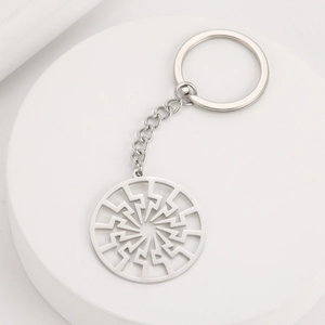Polished stainless steel keychain featuring a circular cutout sunwheel lightning pendant