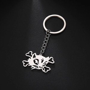 Detailed macro view of the punk cat skull and crossbones stainless steel keychain pendant