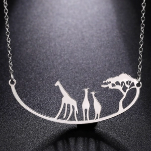 Polished stainless steel giraffe and tree silhouette pendant necklace on black background