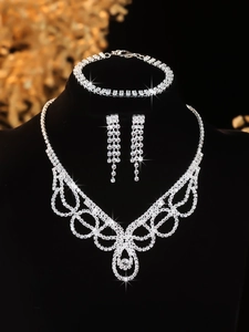 Macro shot of luxurious silver bridal jewelry set with sparkling rhinestones and tassels