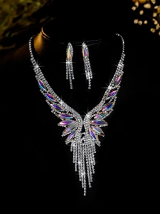 Detail of silver bridal jewelry set with AB crystals and tassels on black bust