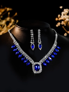 Detail of luxury bridal jewelry set with navy blue stones and zircon on a neck bust