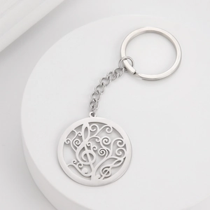 Polished stainless steel keychain with hollow circular musical note and scroll pendant