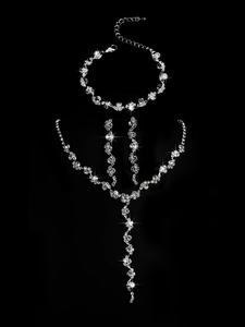 Detailed view of silver zircon jewelry set including necklace and tassel earrings