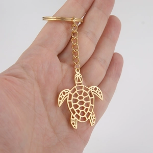Porte-clés tortue en acier inoxydable doré avec design géométrique découpé