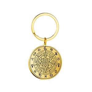 Gold stainless steel keychain with engraved astrological symbols and mystical star pendant