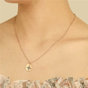 Rose gold stainless steel necklace featuring a Celtic knot pendant on a cable chain