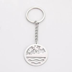 Polished stainless steel keychain featuring a circular cutout tropical palm beach pendant