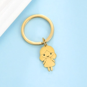 Porte-clés doré en acier inoxydable avec pendentif petite fille sur fond bleu pastel