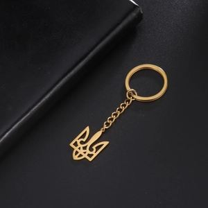Detailed view of a gold-plated stainless steel keychain with Ukraine Tryzub emblem