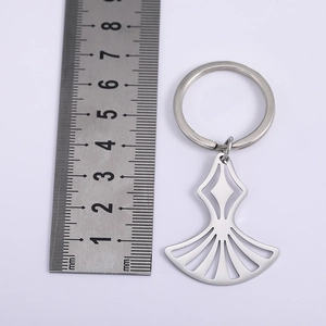 Hollow fan-shaped stainless steel keychain with measurement scale on white background
