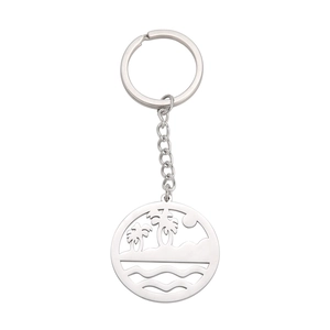 Polished stainless steel keychain with hollow circular pendant featuring a beach beach design