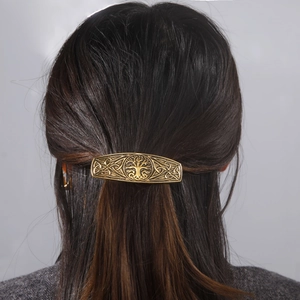 Retro bronze tree of life hair clip with Celtic knots on back of female model head