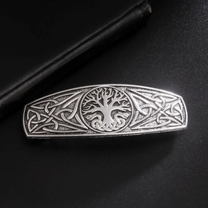 Detailed relief of vintage silver Celtic Tree of Life hair clip with intricate knot patterns