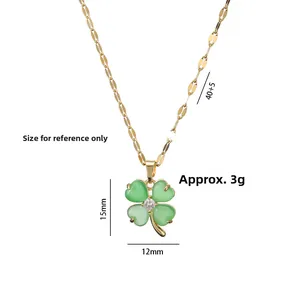 Golden clover pendant necklace with green stone and zircon detail on thin chain