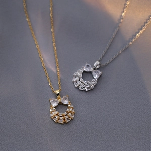 Sparkling zircon bow pendant necklace in gold and silver finish for women's jewelry