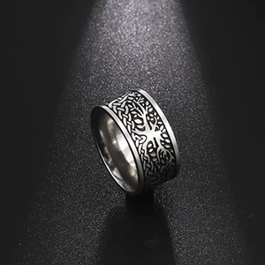 Macro shot of stainless steel Tree of Life ring with vintage Celtic knot patterns