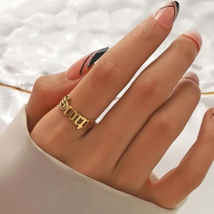 Minimalist gold stainless steel ring with Gothic Baby cut-out lettering for women