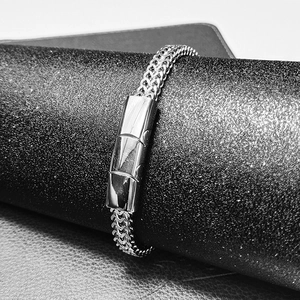 Macro shot of polished stainless steel Cuban chain buckle with magnetic clasp closure