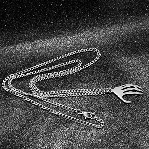 Gothic punk stainless steel necklace with skeleton hand pendant on black background