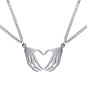 Detail of gothic stainless steel necklace set with skeleton hands forming a heart shape