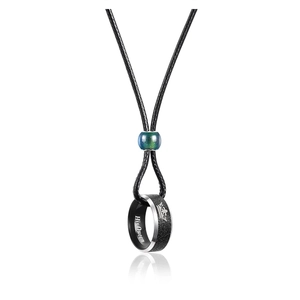 Close-up of leather cord necklace with a color-changing bead and 'His Queen' engraved ring