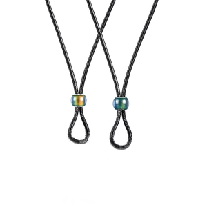 Minimalist black cord necklaces featuring color-changing gradient beads on white background