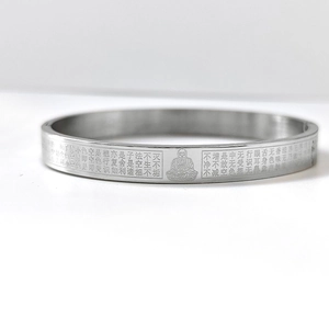 Detailed laser engraving of Heart Sutra and Buddha on stainless steel cuff bracelet