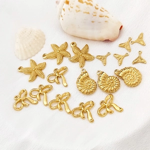 Goldene Ozean-Anhänger mit Seestern, Fischschwanz, Schleife und Muschel für DIY-Schmuck