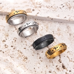Star and moon engraved stainless steel fidget spinner rings in gold, silver, and black