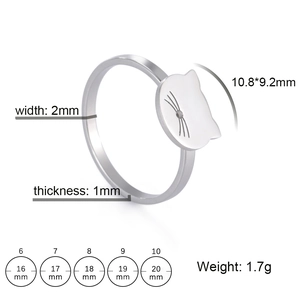 Polished stainless steel cat shape ring with engraved whiskers on a white background
