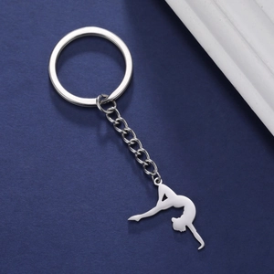 Polished silver gymnast silhouette pendant on a stainless steel keychain ring