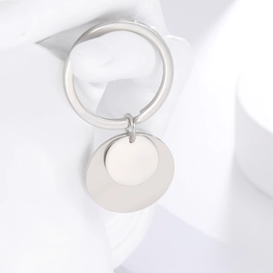 Close-up of a silver polished stainless steel keychain with double round pendant tags