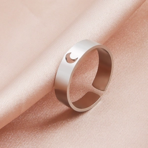 Polished stainless steel adjustable open ring featuring a hollow crescent moon on pink silk