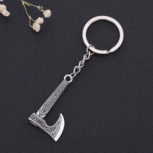 Detailed view of Viking axe keychain featuring intricate Celtic knot patterns on silver alloy