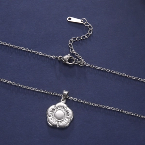 Close-up of a silver flower pendant necklace with 304 stainless steel chain and lobster clasp