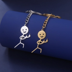 Polished gold and silver funny stickman pendants on stainless steel keychains