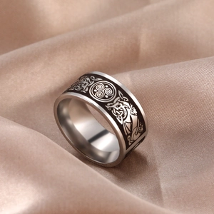 Vintage stainless steel ring with laser-etched Celtic dragon and triskele symbols