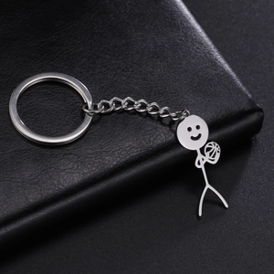 Close-up of polished silver steel keychain featuring a stick figure playing basketball