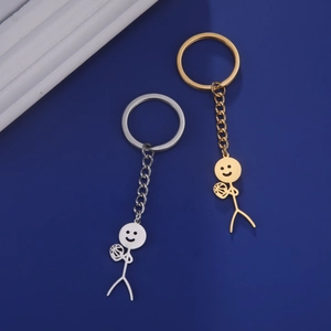 Detail of stickman basketball keychain in polished gold and brushed silver finish