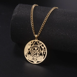 Macro detail of golden Egyptian Eye of Horus pendant on thick Cuban chain