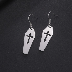 Polished silver stainless steel coffin earrings with hollow cross design on black background