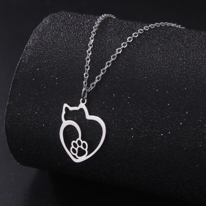 Minimalist stainless steel necklace featuring a hollow heart and cat paw pendant in silver