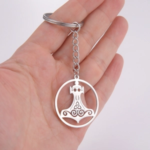 Celtic Mjölnir Thor's Hammer stainless steel keychain held in hand for size context
